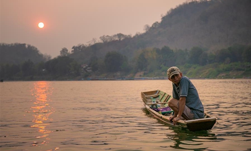 Laos suspends tourist visas, closes schools to prevent COVID-19