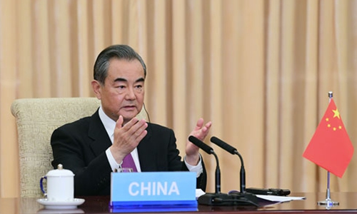 State Councilor and Foreign Minister Wang Yi defends WHO and calls for global governance and cooperation amid pandemic