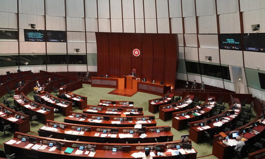 Eight HK lawmakers charged with contempt, interfering with legislative meeting