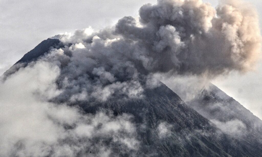 Indonesia’s most active volcano emits hot clouds