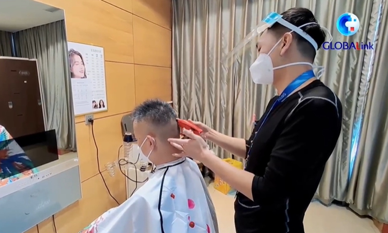 ‘This experience is priceless to me’: exploring the story of a barber at Beijing 2022