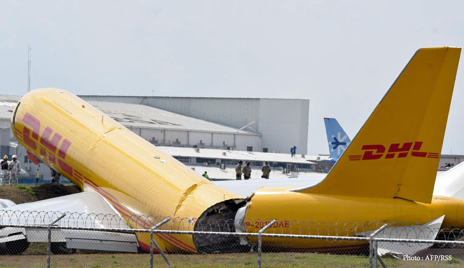 The plane that was landing was torn in two on the runway