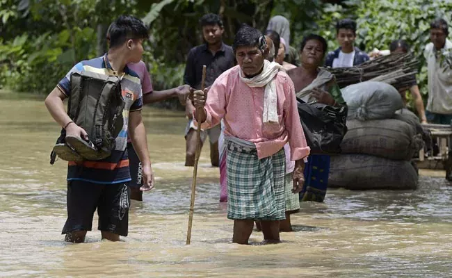 In Assam, floods and landslides kill nine people and affect millions