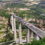 Bridge with world’s tallest rigid-frame pier opens to traffic in SW China