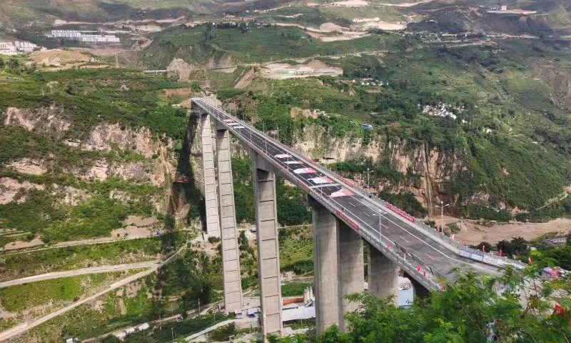 Bridge with world’s tallest rigid-frame pier opens to traffic in SW China