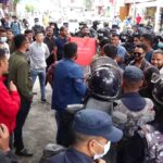 A black banner in Baluwatar demanding the resignation of Governor Maha Prasad Adhikari