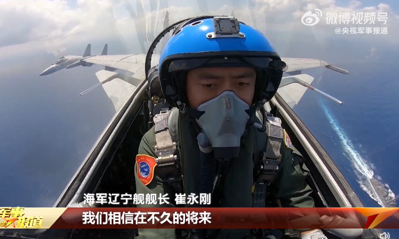 Chinese state media reveals carrier-based J-15 fighter flyover of suspected foreign warship