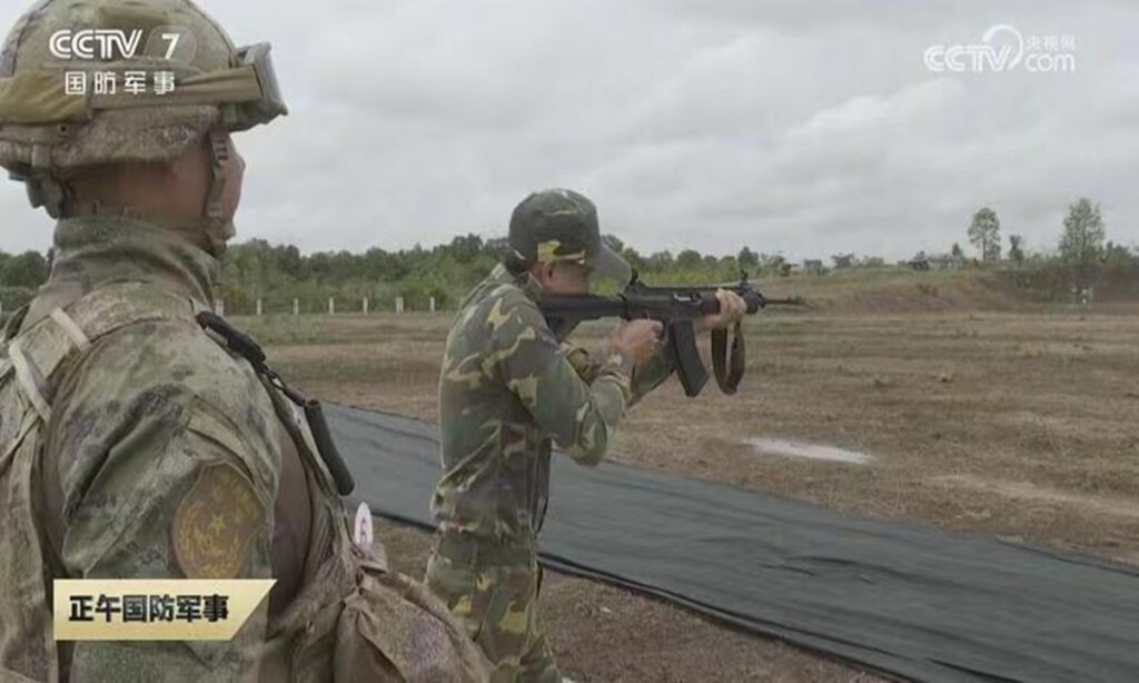 Chinese, Lao troops exchange weapons in live-fire joint drills, displaying trust