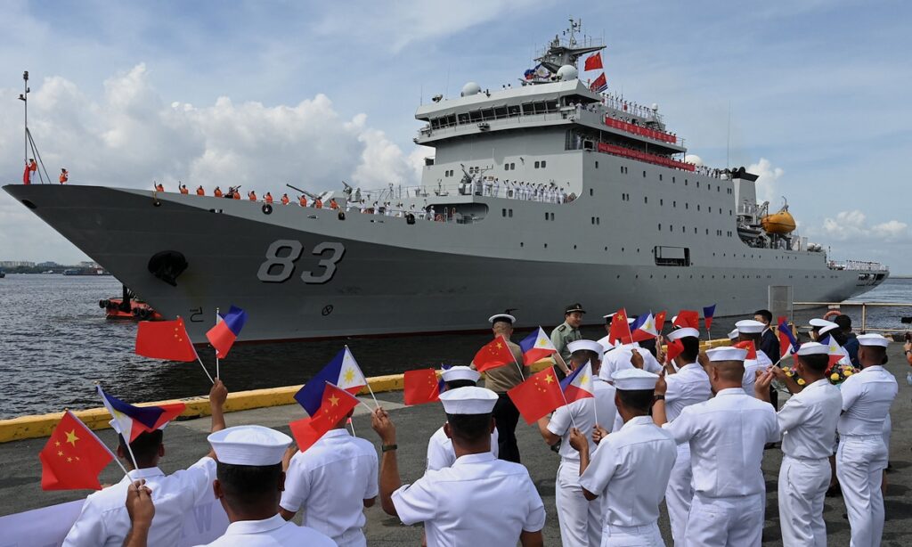 US aircraft carrier enters South China Sea in show of strength while Chinese naval ship visits Southeast Asian countries for friendship