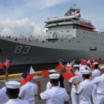 US aircraft carrier enters South China Sea in show of strength while Chinese naval ship visits Southeast Asian countries for friendship