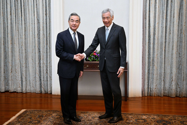 China eyes shared interests with Singapore, opposes hegemony, protectionism