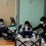 Hospitals across China grapple with respiratory illnesses surge