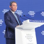 Li urges global cooperation, vows continued opening-up at WEF